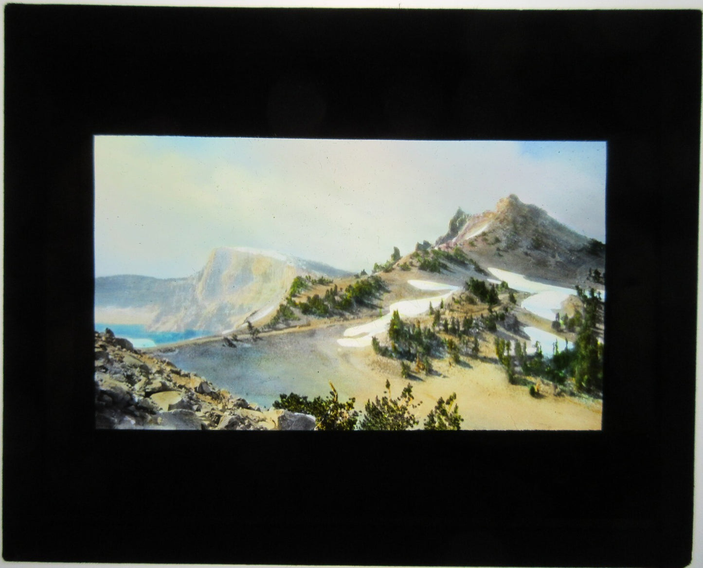 SNOW ON MOUNTAIN SUMMIT. HAND COLORED LANTERN SLIDE.