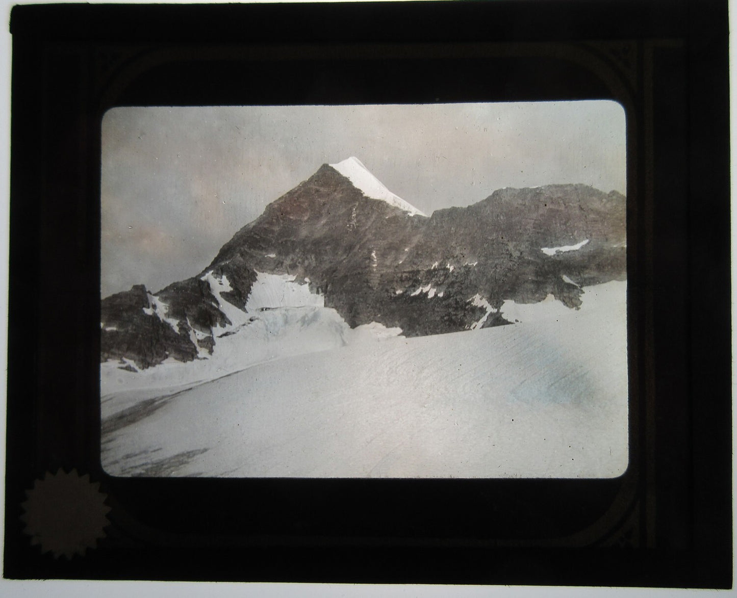 SNOW CAPPED MOUNTAIN SUMMIT, STARK, COLD SCENE. LANTERN SLIDE.
