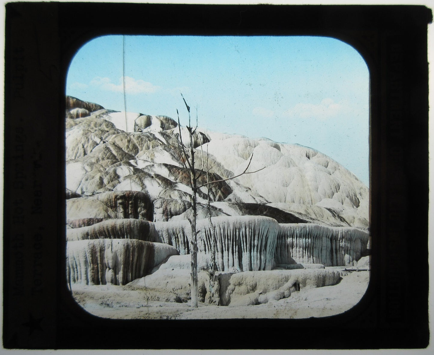 MAMMOTH HOT SPRING. HAND COLORED PHOTO ON GLASS.