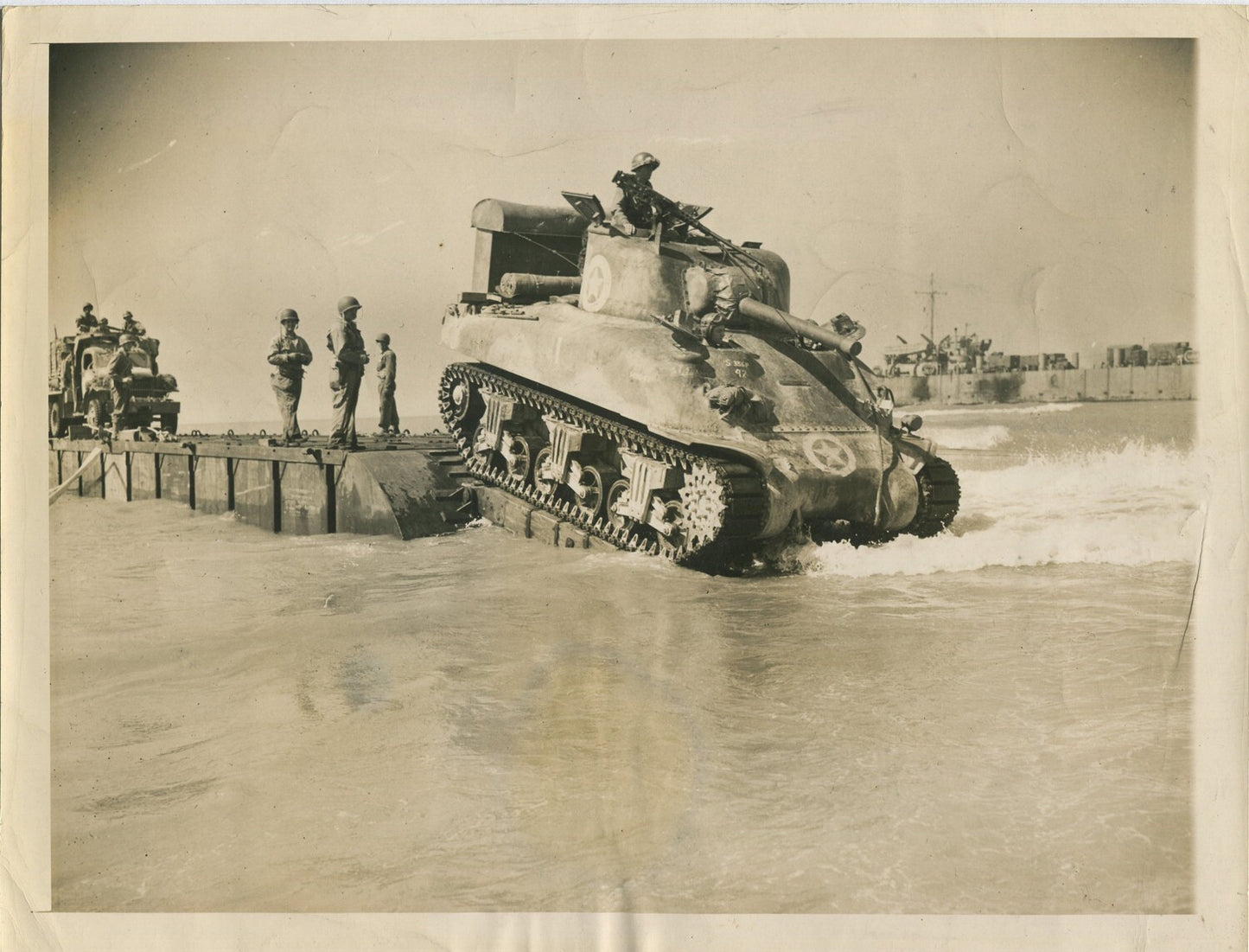 TANK ROLLS OFF LANDING CRAFT. SICILY, ITALY. WWII. (8X10 REPRINT)