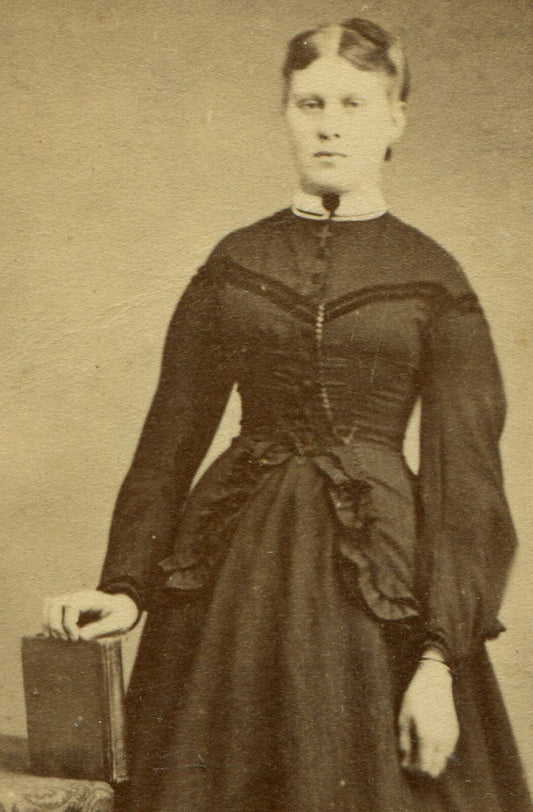 WOMAN STANDING POSE AT TABLE W/BOOK IN HAND. CDV. SELINSGROVE, PA.