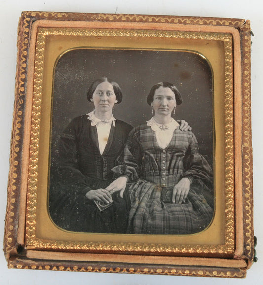 DAGUERREOTYPE TWO WOMAN AFFECTIONATE POSE, BOTH HOLD  DAG CASE. TINTED, UNIQUE.