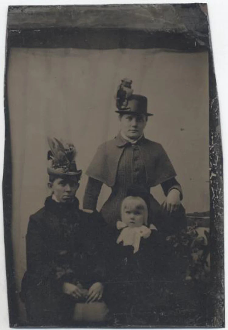 UNMOUNTED TINTYPE, TWO WOMEN AND A YOUNG GIRL, LARGE HATS AND WIDE EYES.
