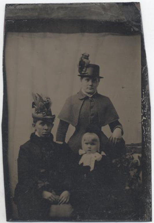 UNMOUNTED TINTYPE, TWO WOMEN AND A YOUNG GIRL, LARGE HATS AND WIDE EYES.