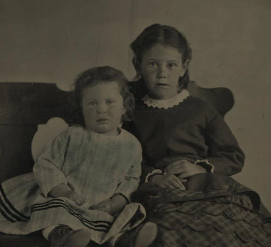 TINTYPE PORTRAIT OF YOUNG SISTERS ON CHAIRS. TINTED, INCREDIBLY SHARP.
