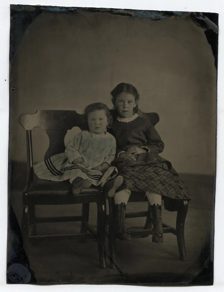 TINTYPE PORTRAIT OF YOUNG SISTERS ON CHAIRS. TINTED, INCREDIBLY SHARP.