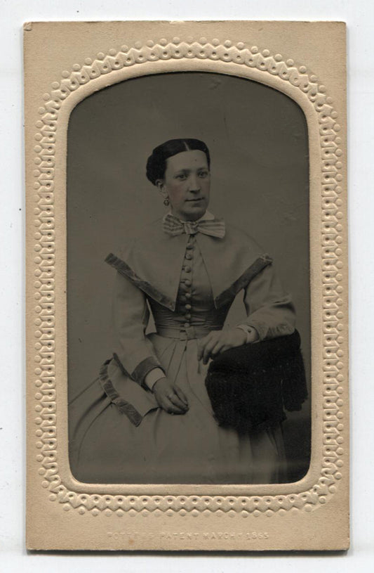 TINTYPE, WOMAN IN SHOULDER CAPE, TINTED. PERIOD MAT WITH MAKER MARK.