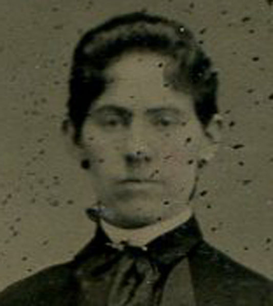 WOMAN POSED AT RUSTIC GATE. TINTED TINTYPE.