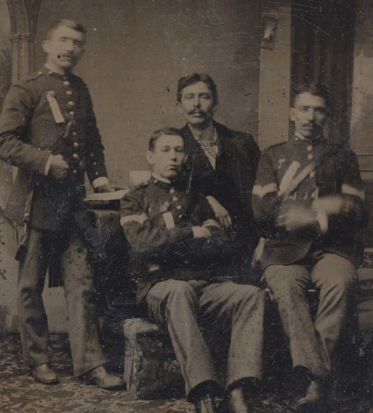 TINTYPE OF FOUR INDIAN WAR SOLDIERS IN UNIFORMS - IN RELAXED POSES