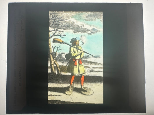 Vintage hand-tinted lantern slide: Canadian on snowshoes, winter campaign, early