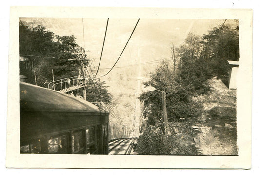 Vintage silver print photo: original cable car approaching steep hill, transit