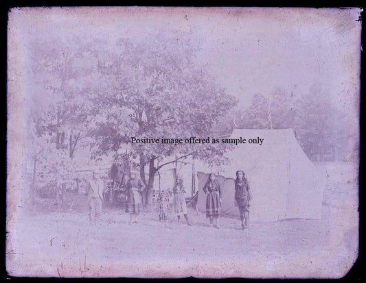 NATIVE AMERICAN FAMILY IN RURAL SETTING. GLASS PLATE NEGATIVE, 8.5 X 6.5 INCHES.