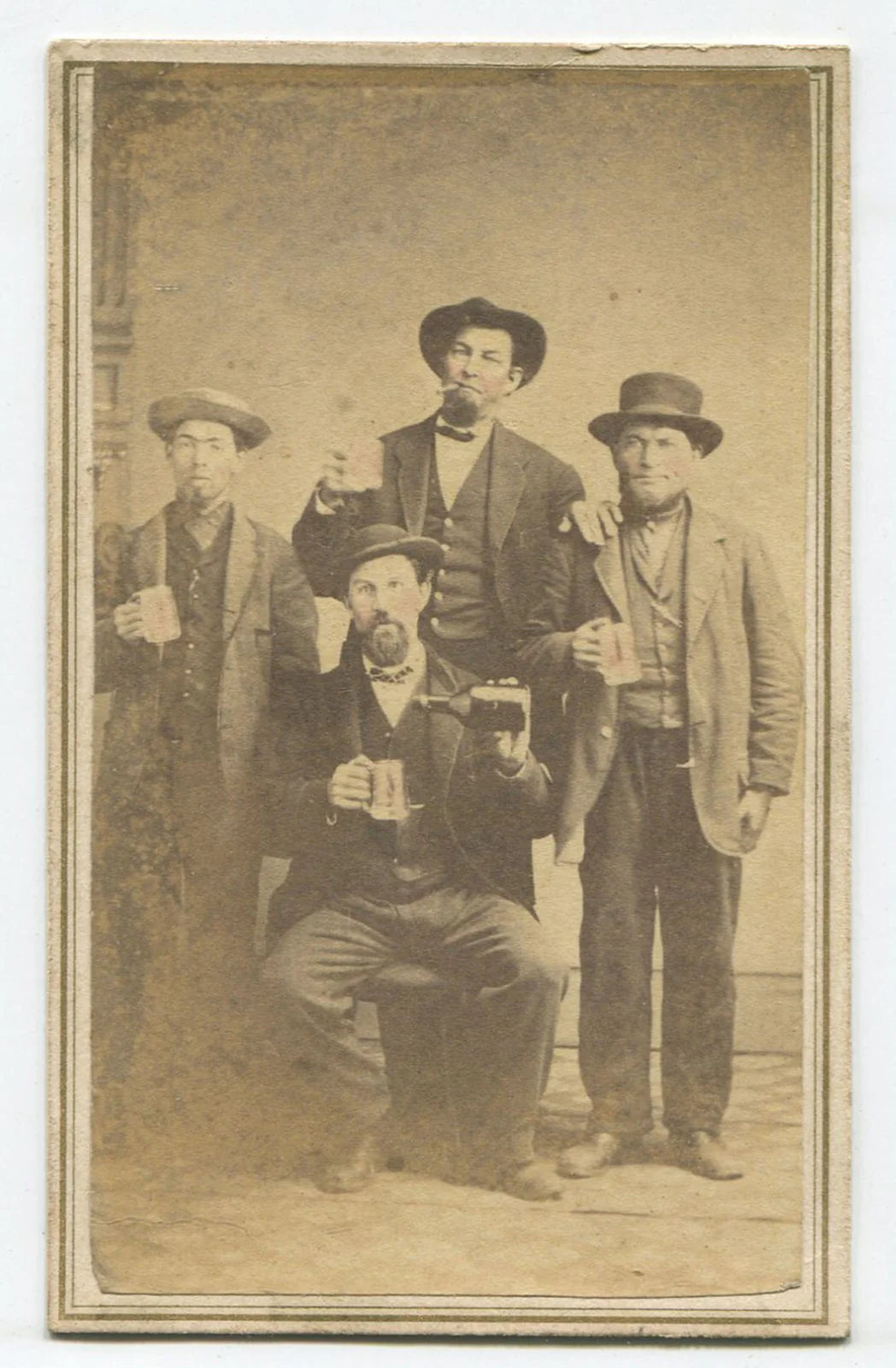 MEN IN HATS POSED HOLDING BEER MUGS, BOTTLE. TINTED CDV. COSHOCTON, OHIO.
