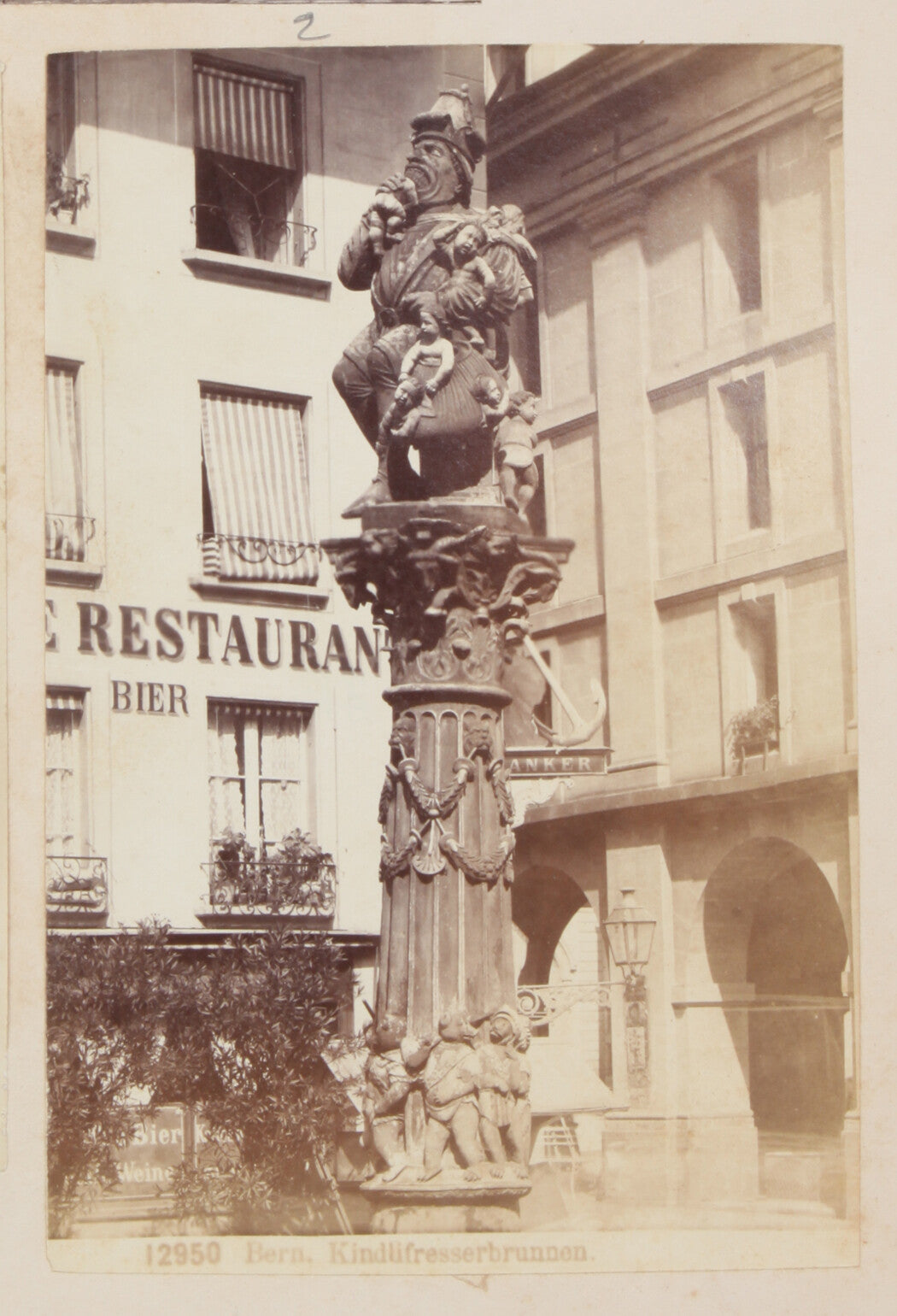 STATUE OF MAN GOBBLING UP YOUNG CHILDREN. BERN, SWITZERLAND. 8x10 reprint