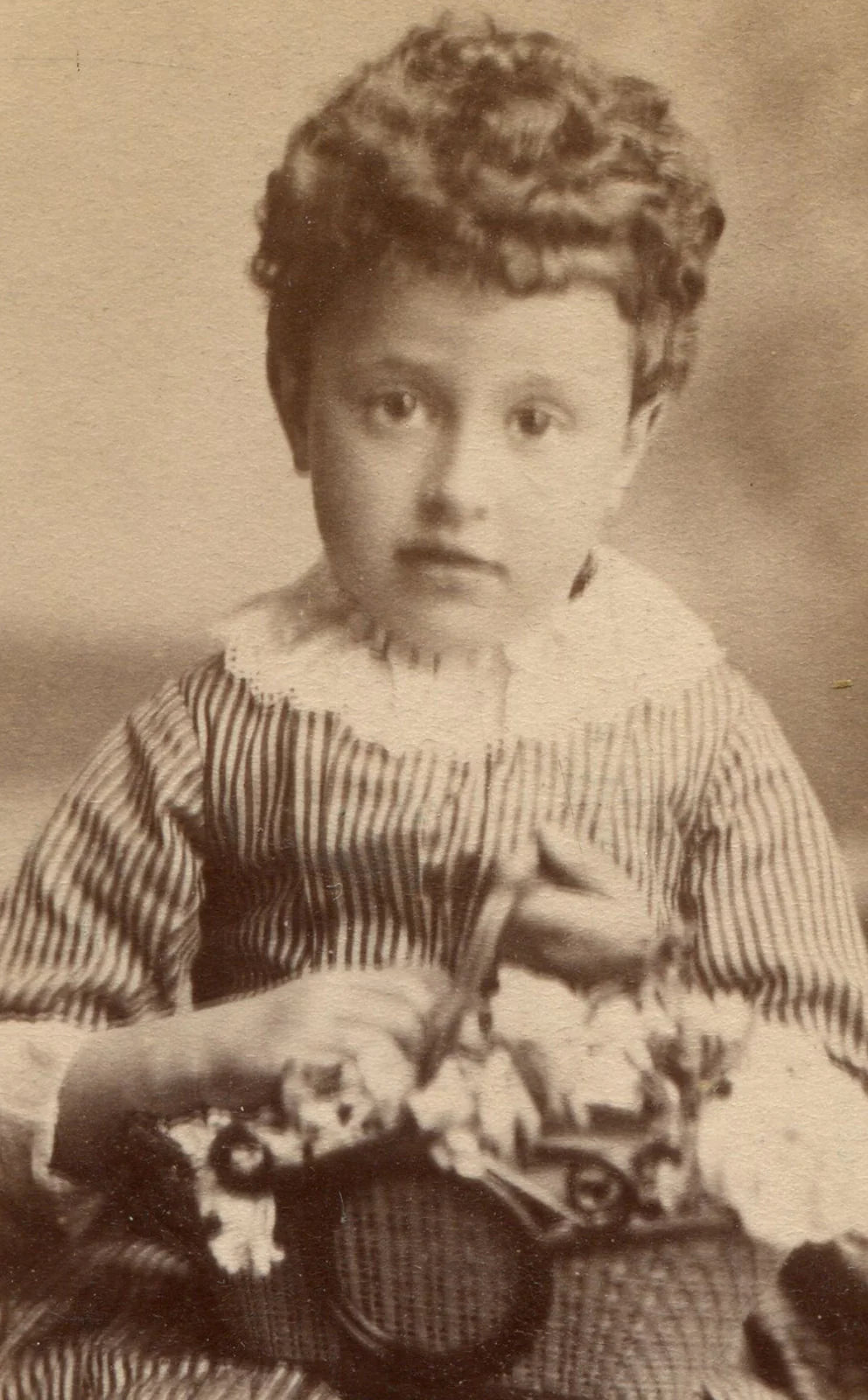 CURLY HAIRED LITTLE GIRL HOLDING BASKET OF FLOWERS. CDV. N.Y.