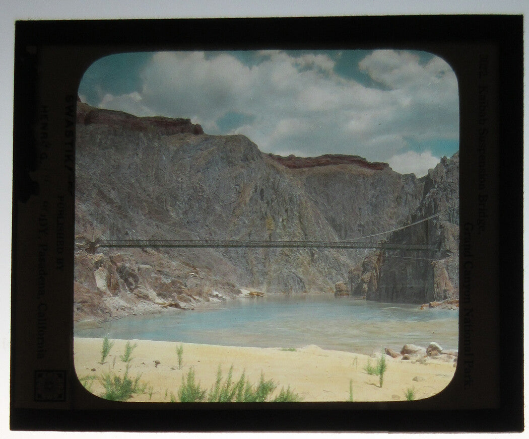 KAIBAB BRIDGE, GRAND CANYON. PHOTO ON GLASS, HAND COLORED.