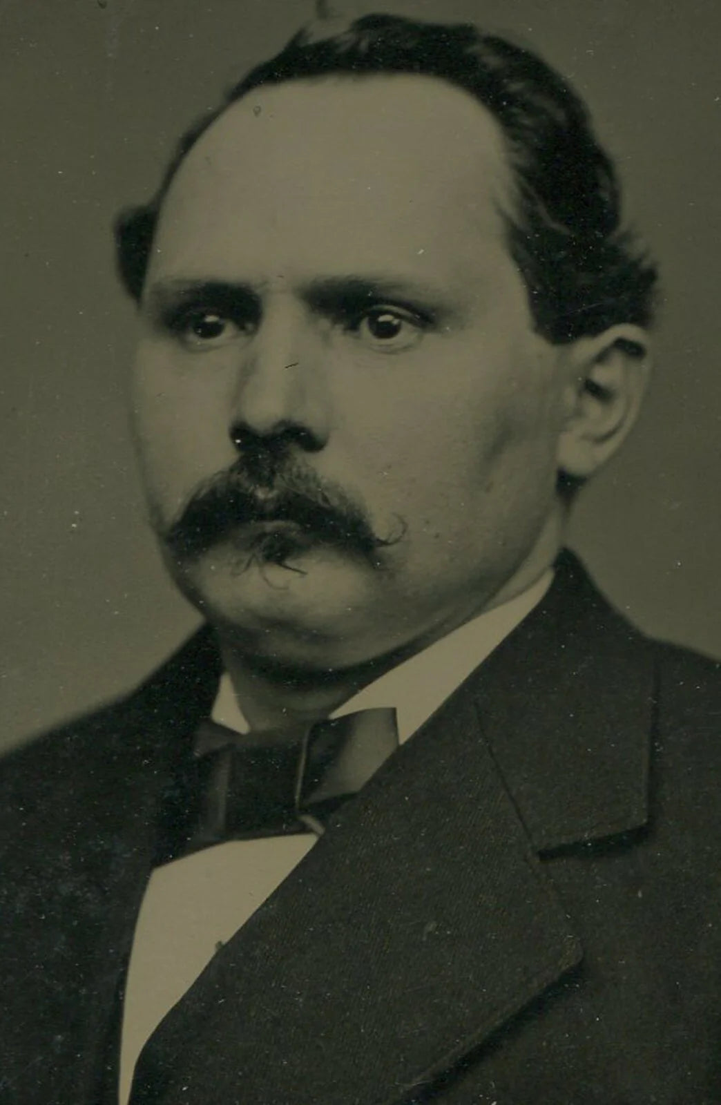 STOIC MAN, MUSTACHE, AND RECEDING HAIRLINE. CRISP TINTYPE IN PAPER MAT, 4 X 6 IN