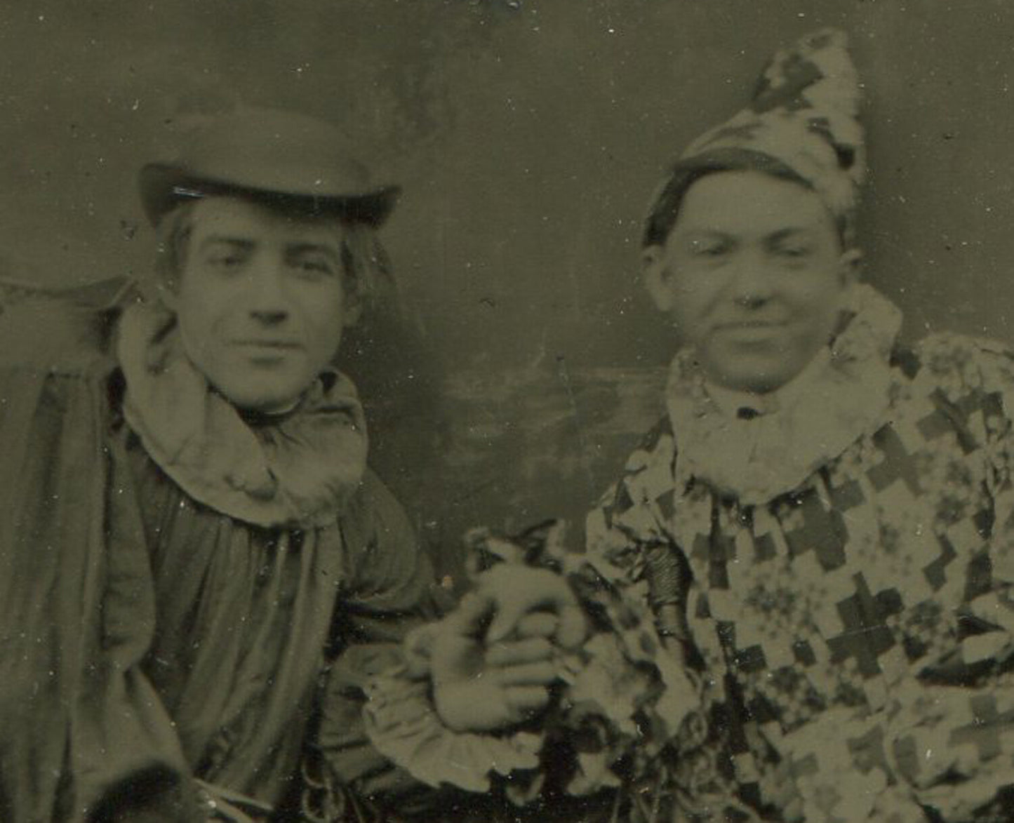 MALE CIRCUS PERFORMERS IN COSTUME. AFFECTIONATE POSE. TINTYPE.