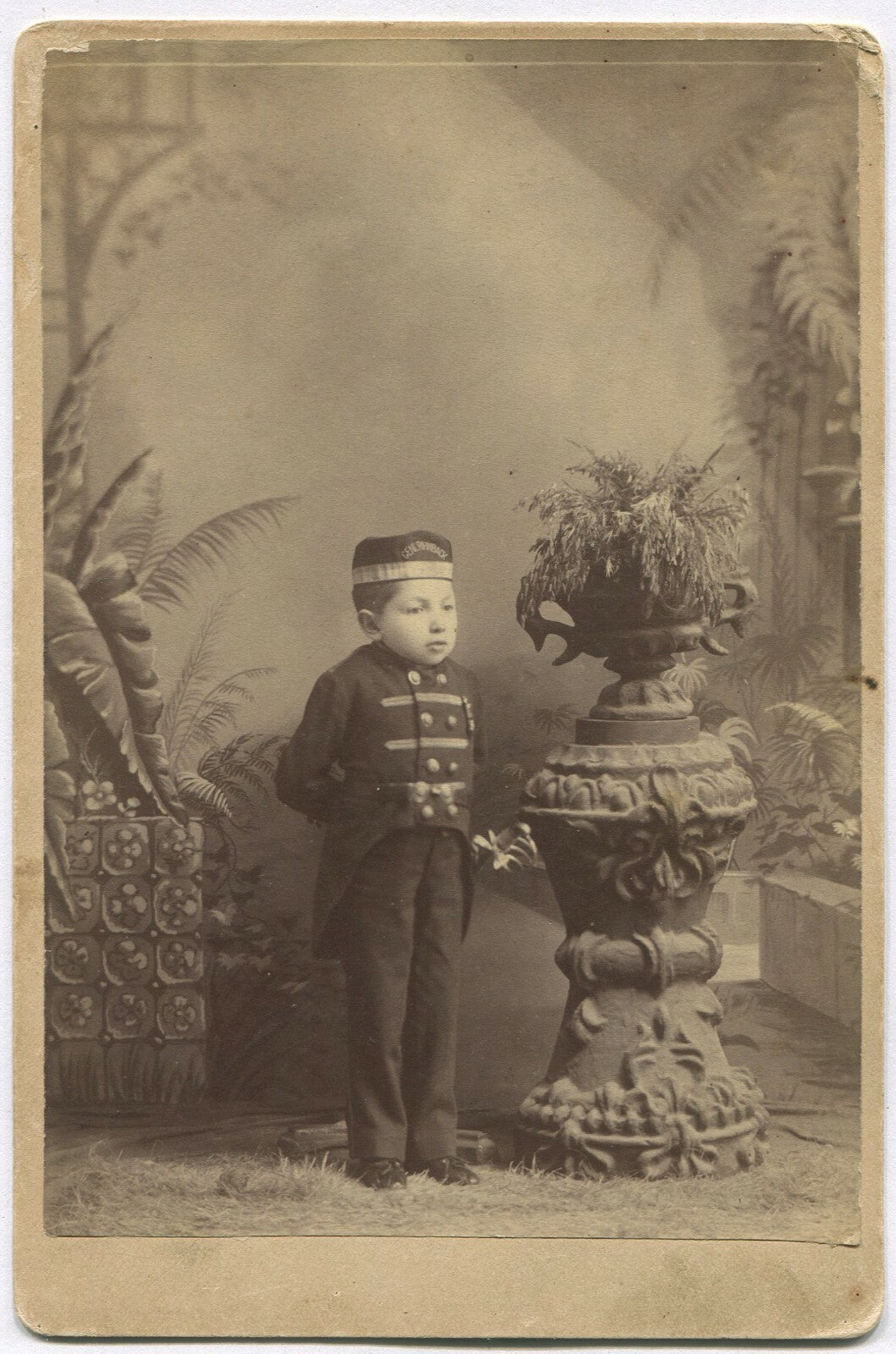 LITTLE PERSON, YOUNG MAN IN UNIFORM. PAINTED BACKGROUND CABINET CARD.