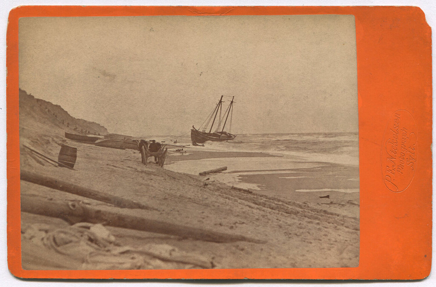 SHIP ON BEACH. CABINET CARD BY NICKELSON, 11X14 ARCHIVAL MAT.
