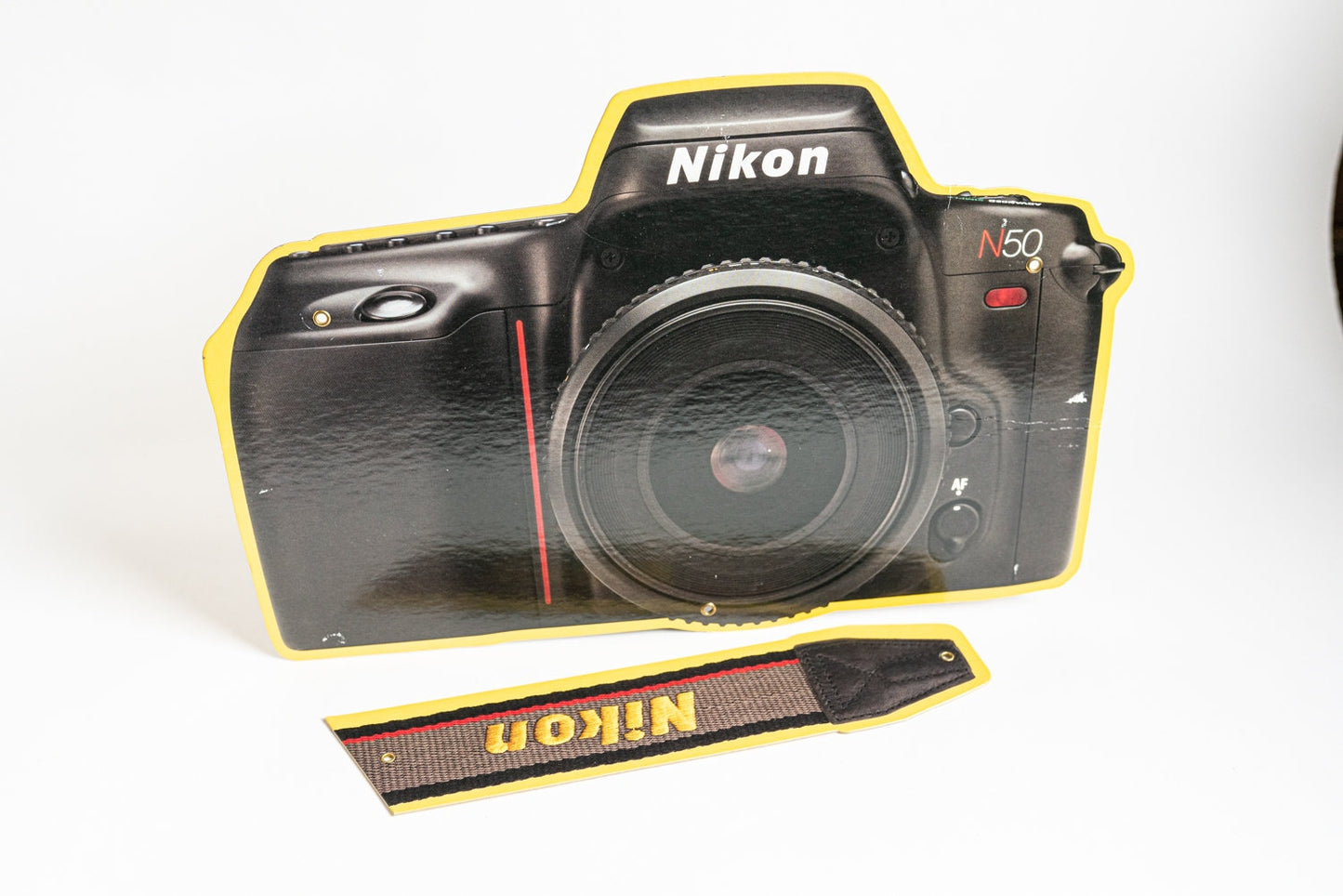 Nikon Camera and Strap Sign