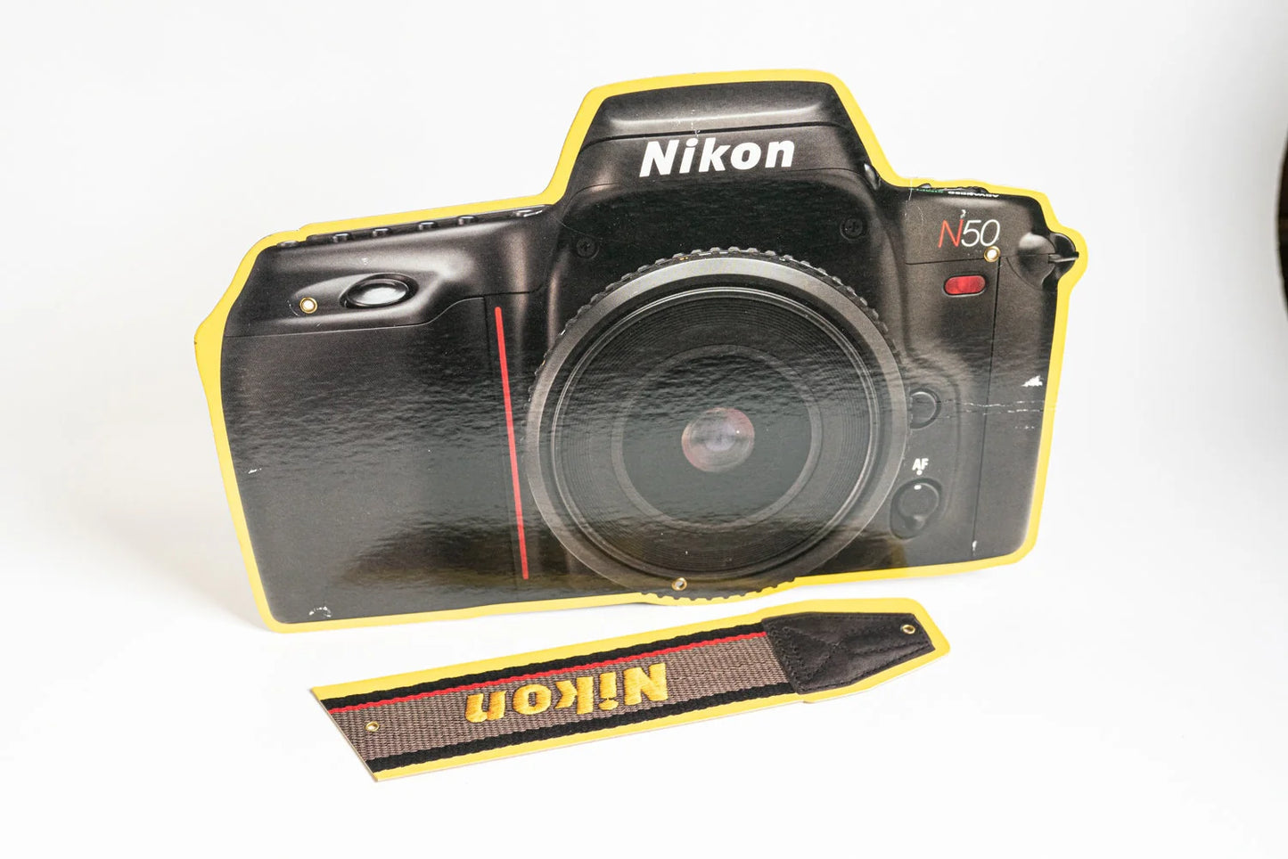 Nikon Camera and Strap Sign