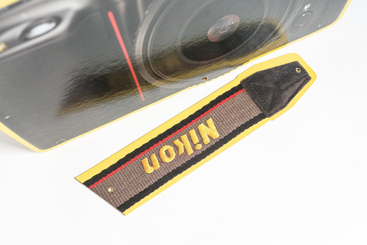 Nikon Camera and Strap Sign