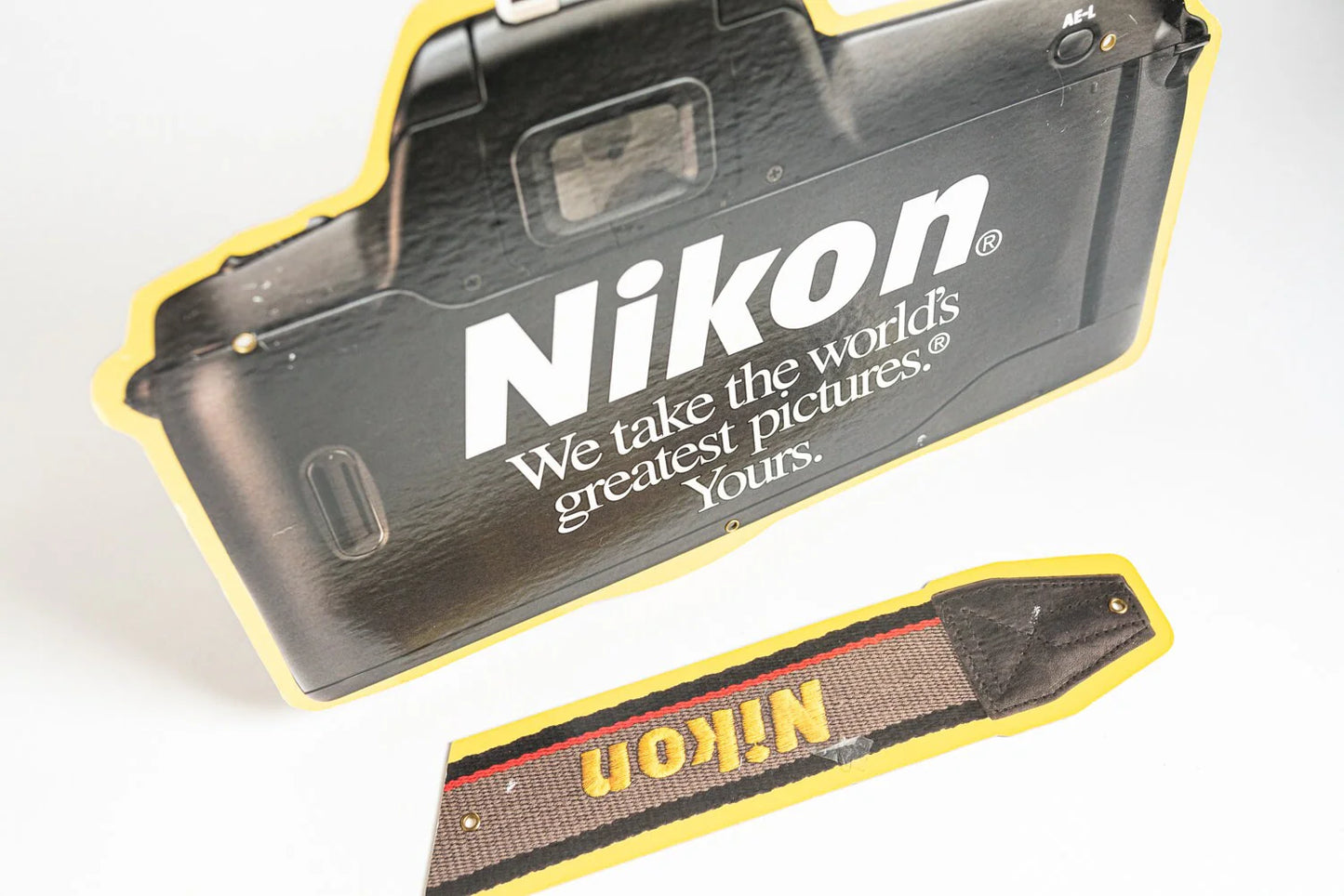 Nikon Camera and Strap Sign
