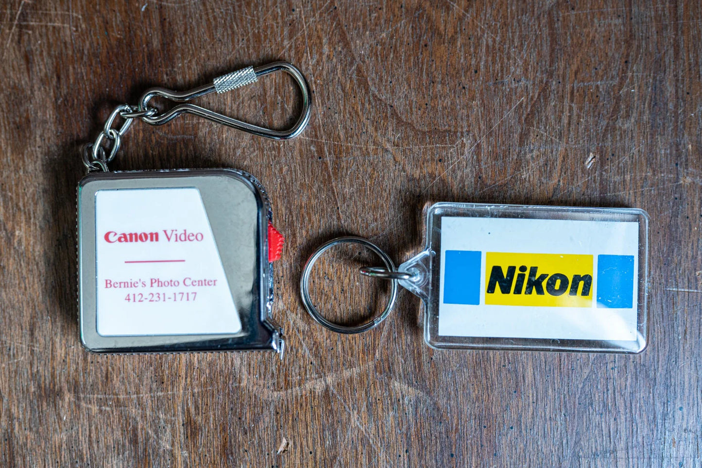 Photo Branded Keychains - Set of 2 - Canon Measuring Tape and Nikon Keychain