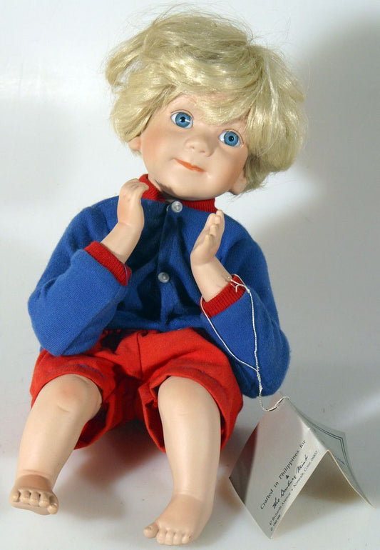 PORCELAIN BLUE EYED BOY BY THE DANBURY MINT