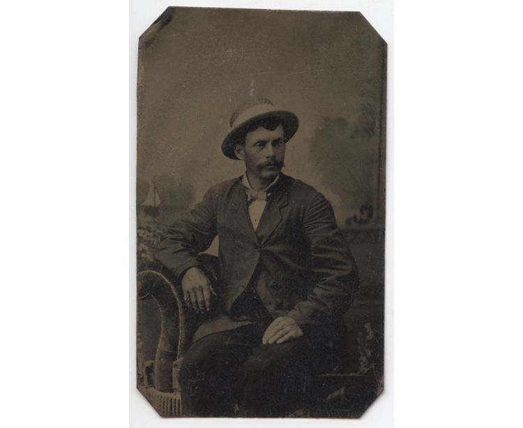 CIVIL WAR ERA TINTYPE MAN W/ STRIPED HAT AND VELVET CHAIR